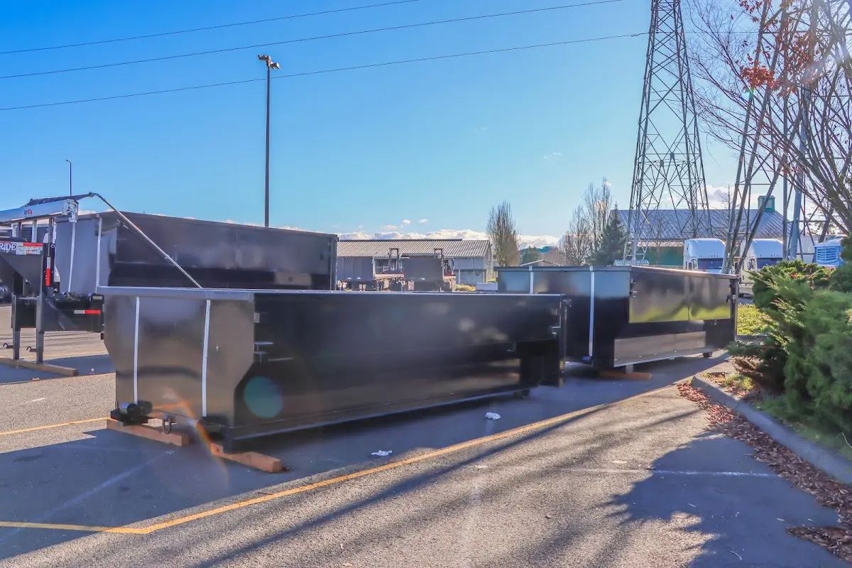 Roll-off dumpster ready for waste disposal at job site for Concrete Dumpster Rental in Westfield